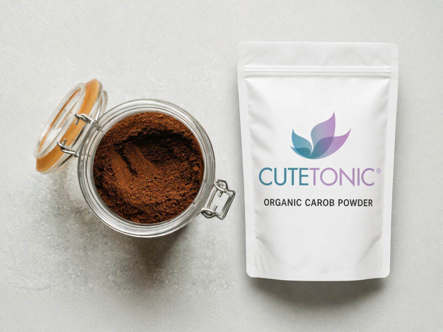 Cutetonic organic carob powder pouch beside a jar of carob powder