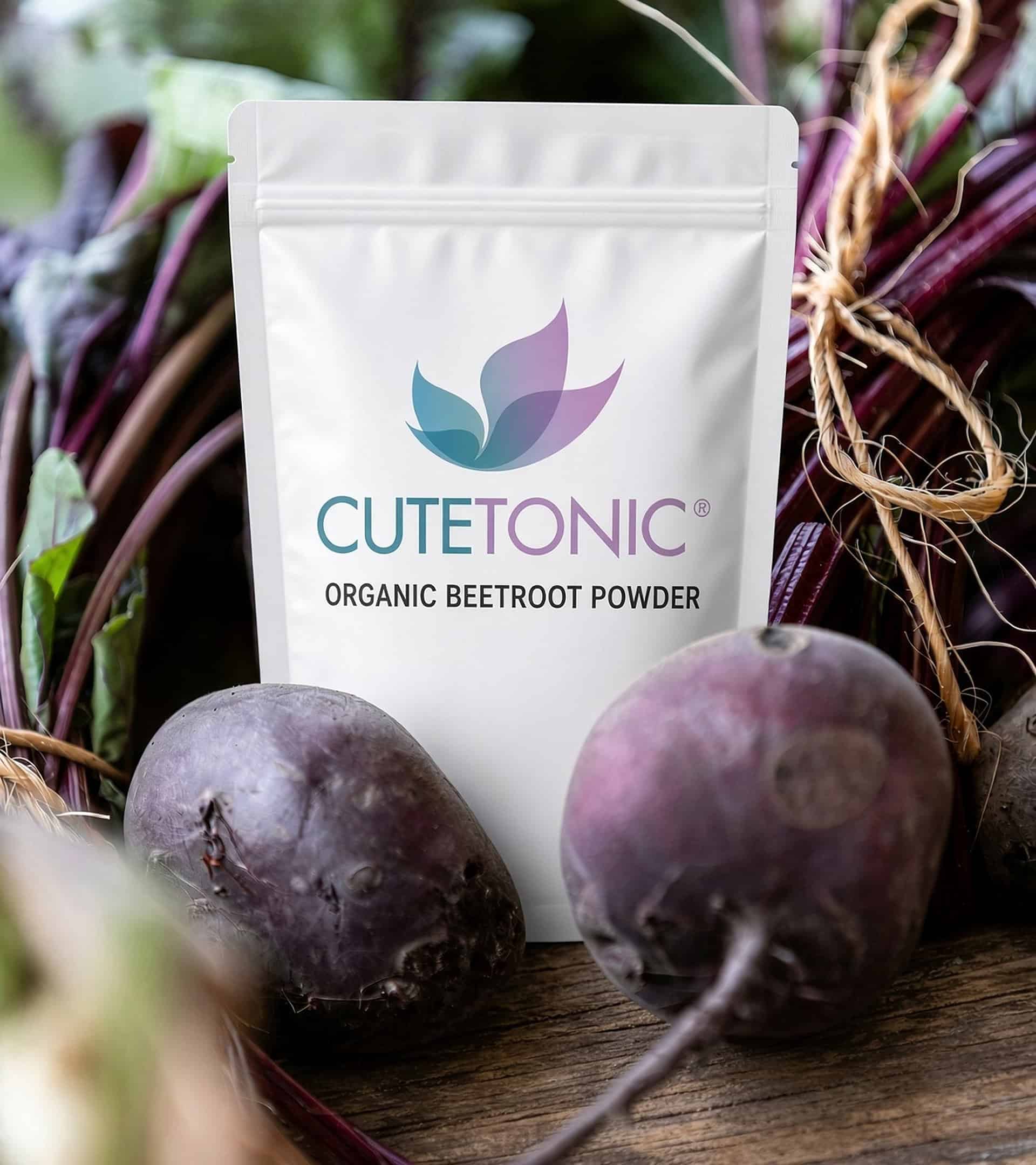 Cutetonic organic beetroot powder pouch in front of fresh beetroot